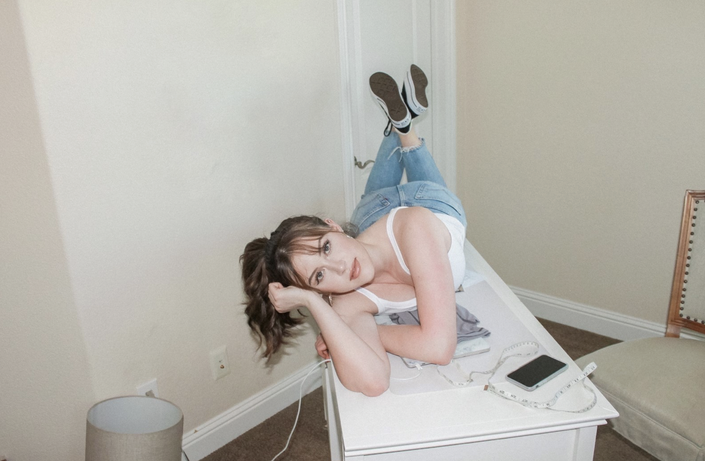 photo of Emma Vollrath lying pensively on a table.