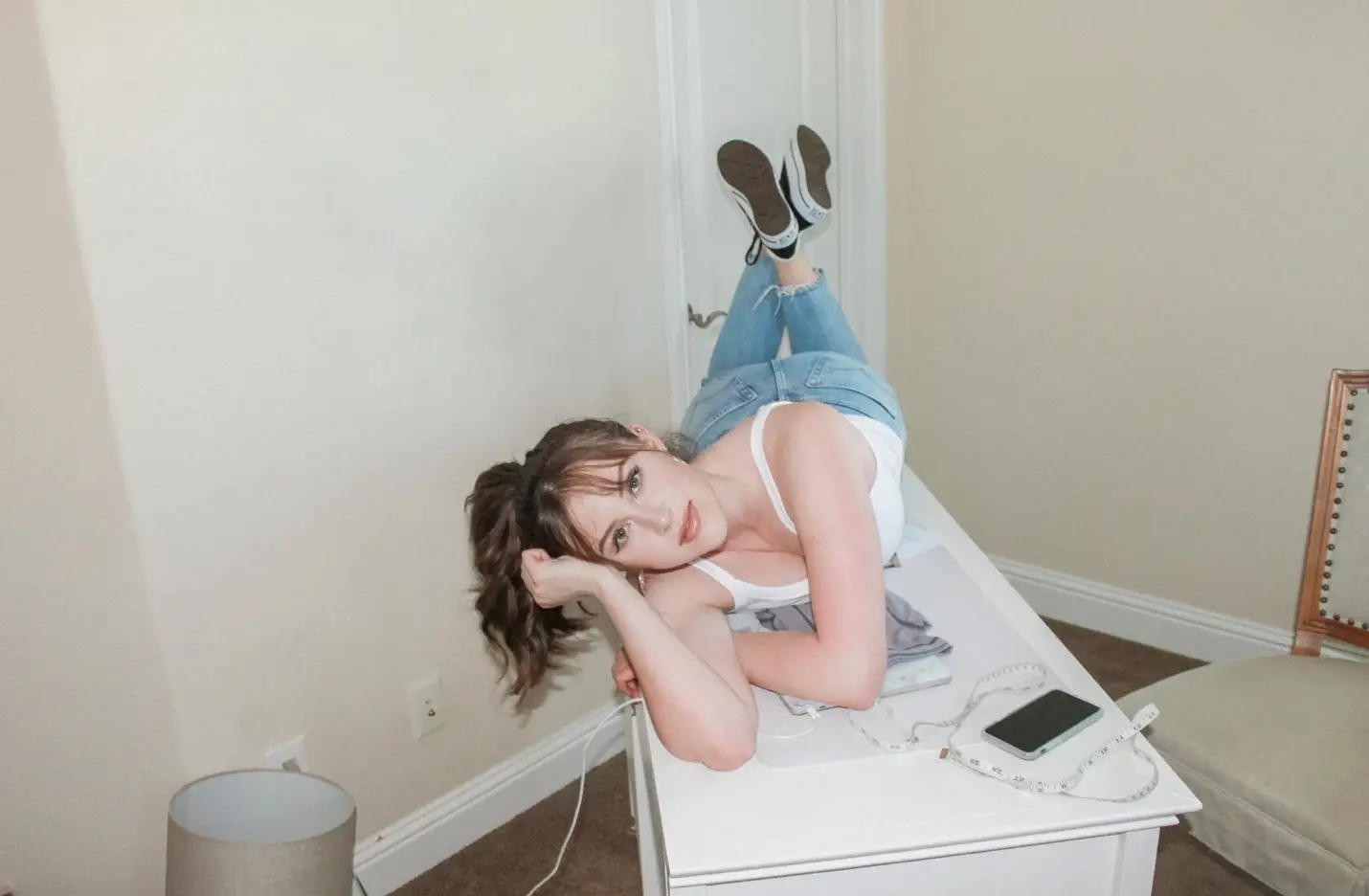 photo of Emma Vollrath lying pensively on a table.