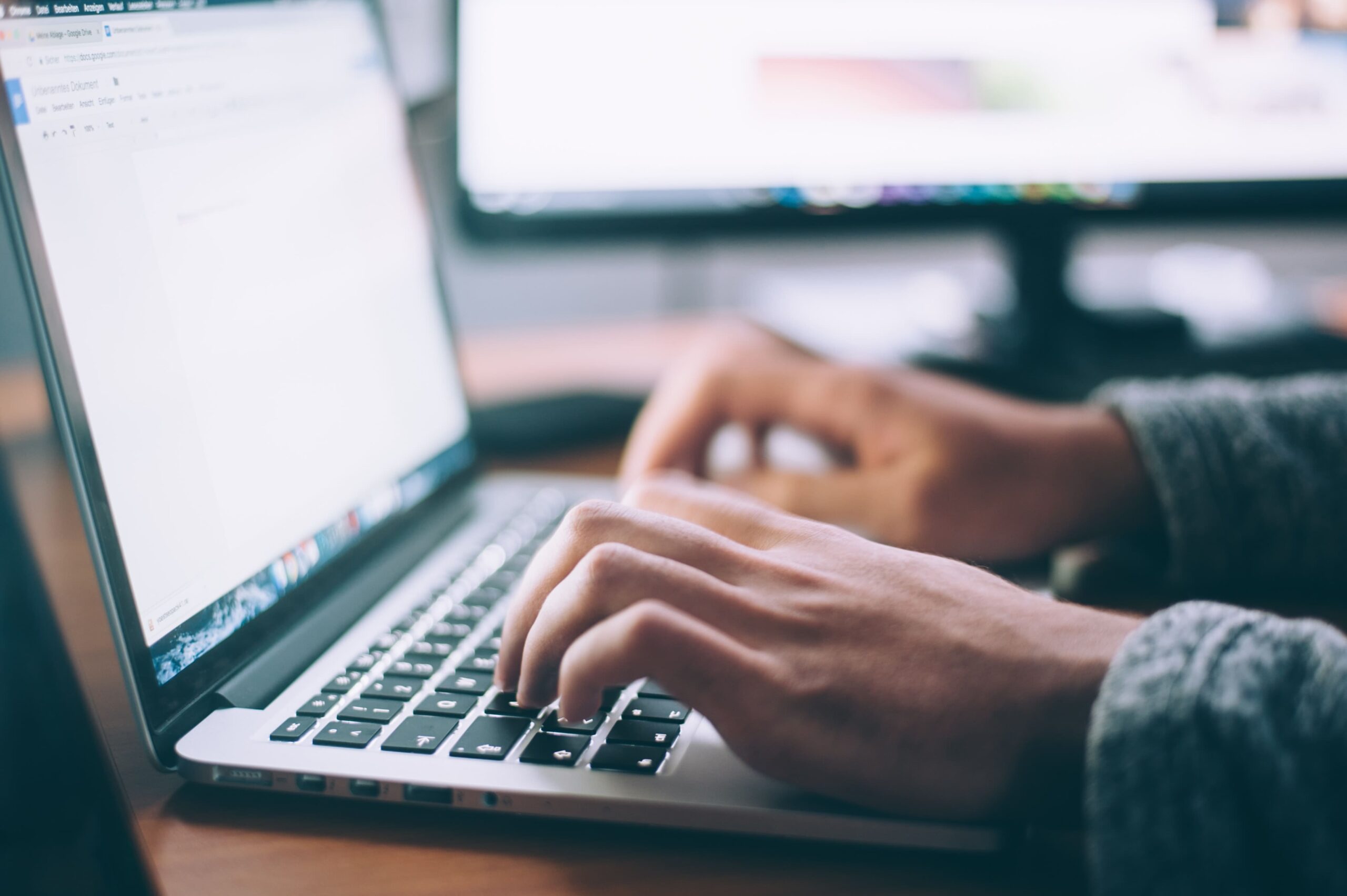 photo of a person typing onto a laptop, data protection article