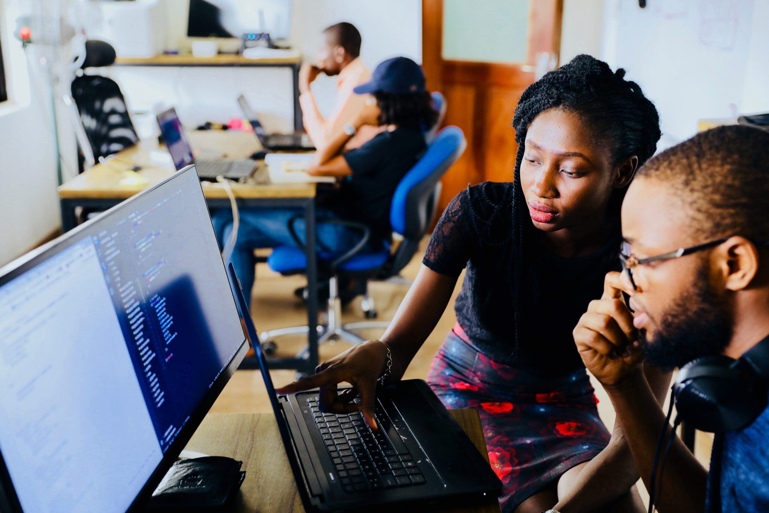 entrepreneurship - photograph of two people working in front of a computer