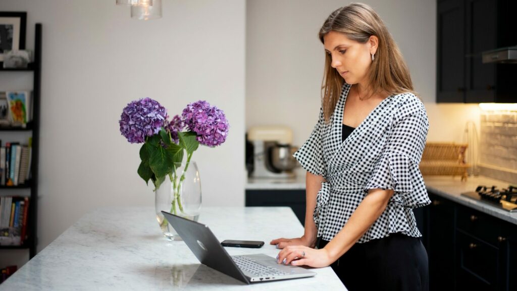 Authenticity Coach Fiona Moss working on laptop